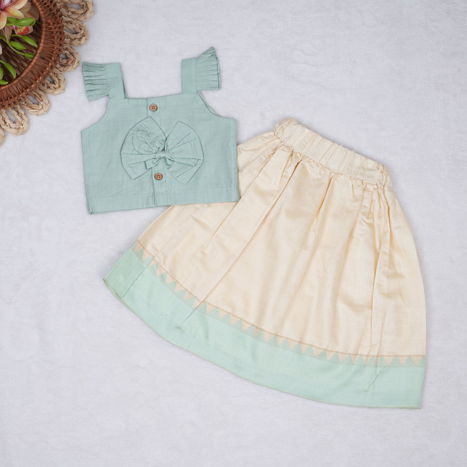 Mint green embroidered cotton top with cream skirt, elastic waist and lining – elegant Kerala-style ethnic wear for girls aged 1–5 years.