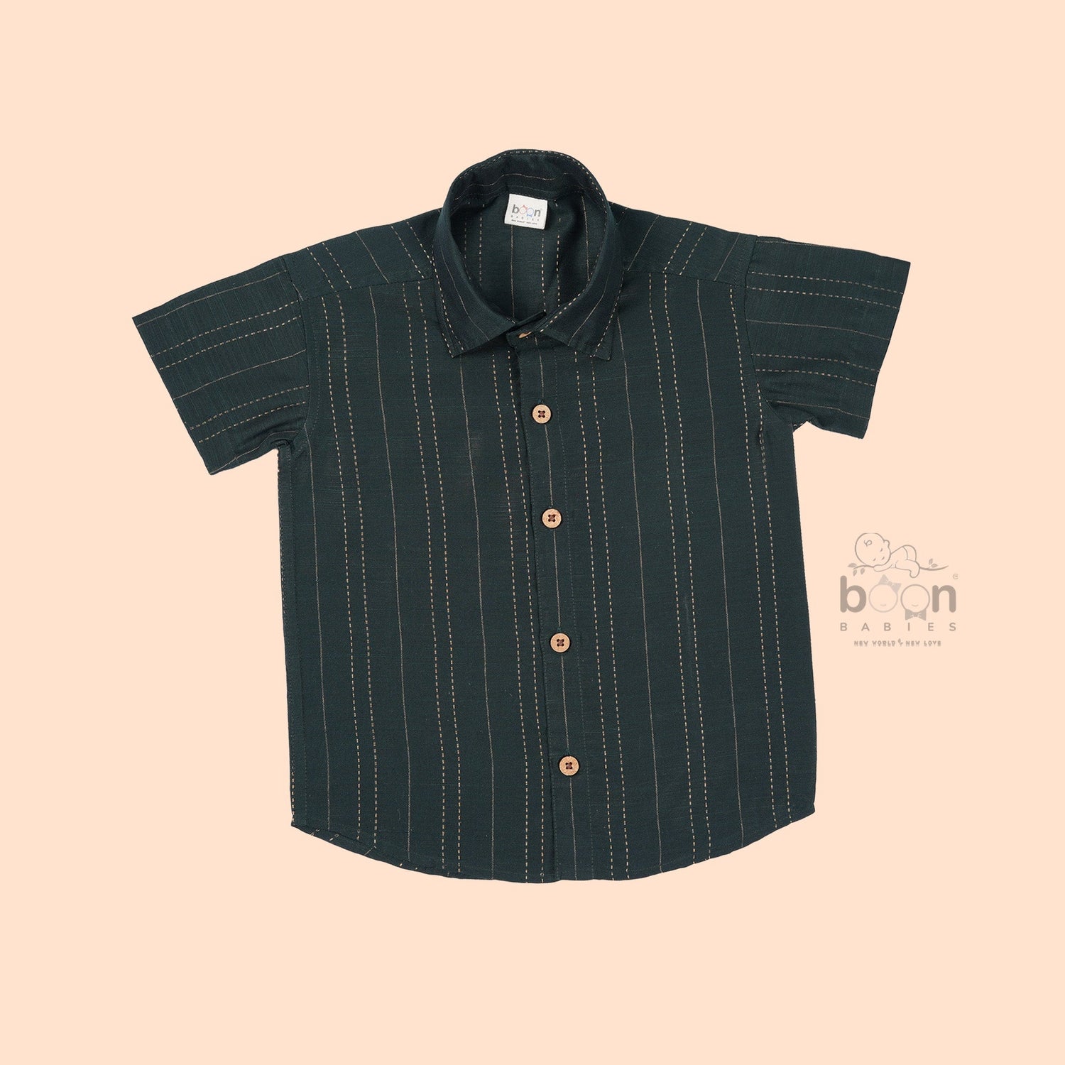 Dark green silk ethnic shirt for boys aged 12 months to 5 years, with golden vertical stripe detailing and wooden buttons – from Boon Babies’ festive wear range.
