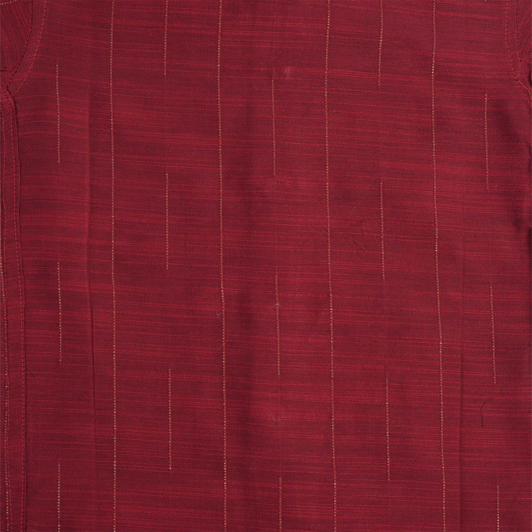 Maroon silk shirt with vertical golden lines, folded next to a traditional white veshti – boys' festive ethnic shirt by Boon Babies, Coimbatore.