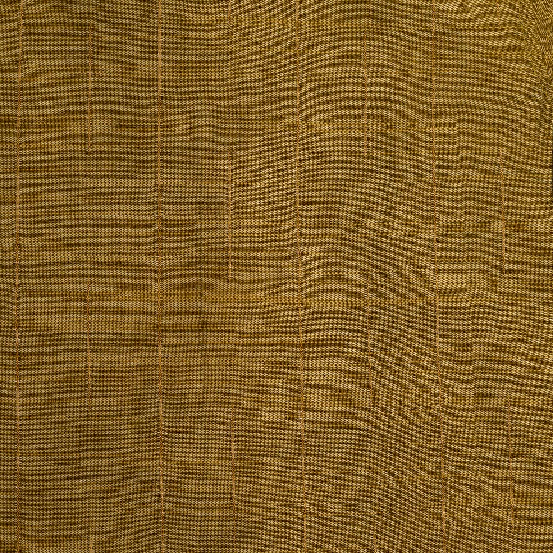 Mustard gold silk shirt with subtle golden stripes, folded beside a traditional white veshti – Boon Babies’ festive ethnicwear for boys in Coimbatore.