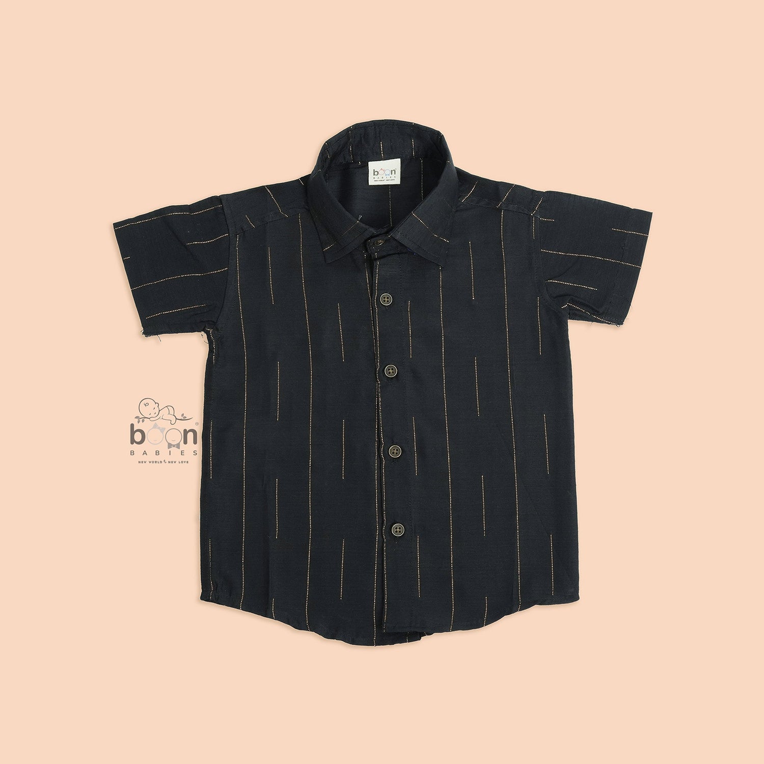 Folded black silk shirt with golden vertical lines, paired with traditional white veshti – premium ethnicwear for boys by Boon Babies, Coimbatore.