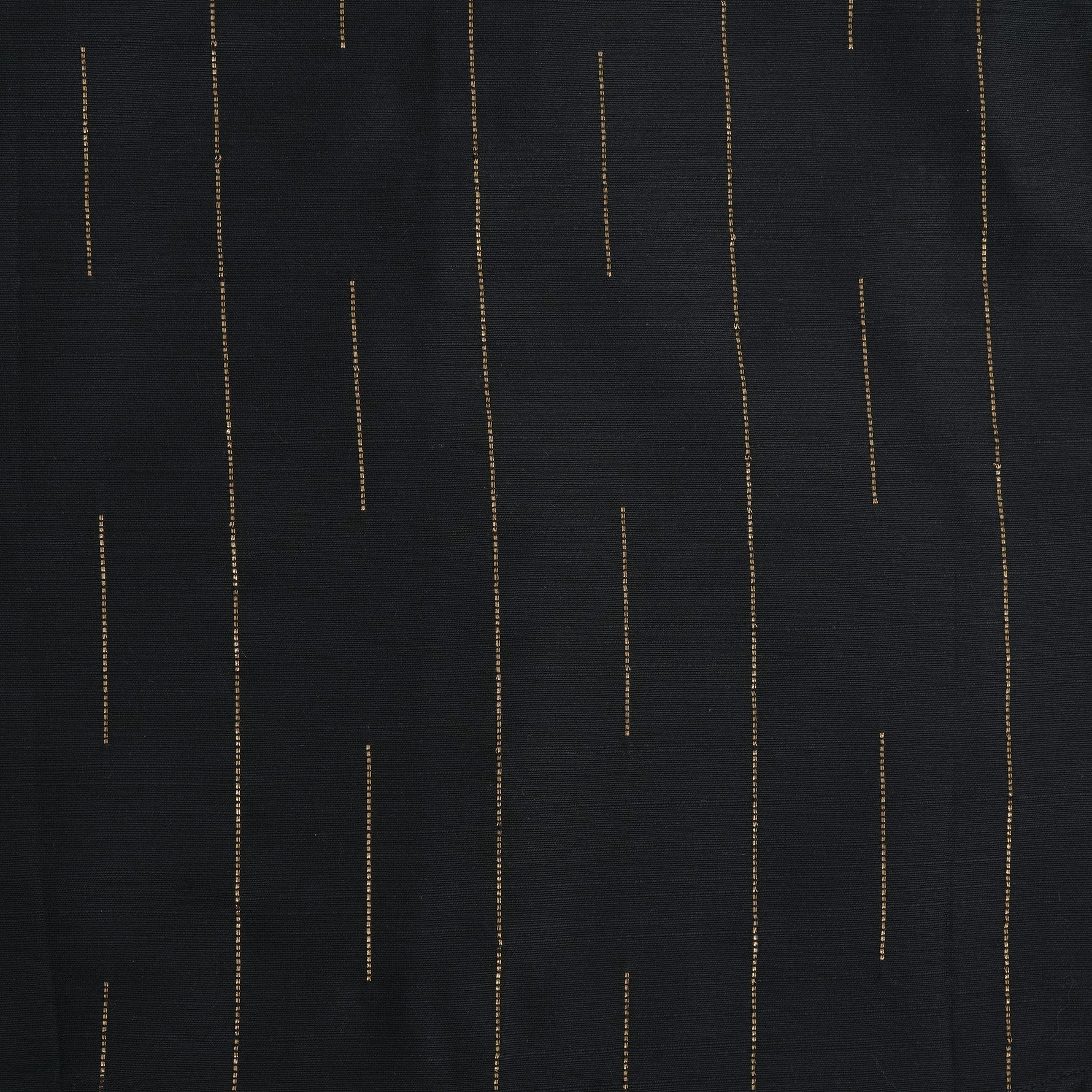 Folded black silk shirt with golden vertical lines, paired with traditional white veshti – premium ethnicwear for boys by Boon Babies, Coimbatore.