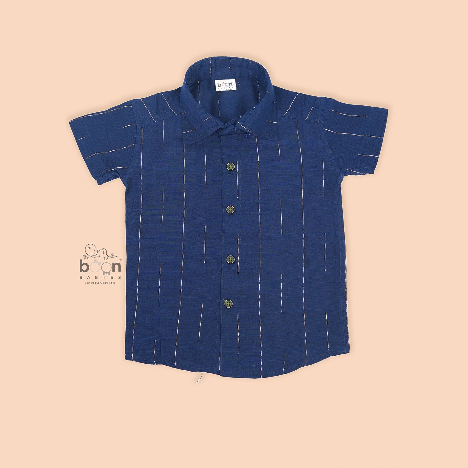 Boys navy blue silk shirt with subtle gold stripes, folded beside a white and gold pattu dhoti – Boon Babies festive wear.