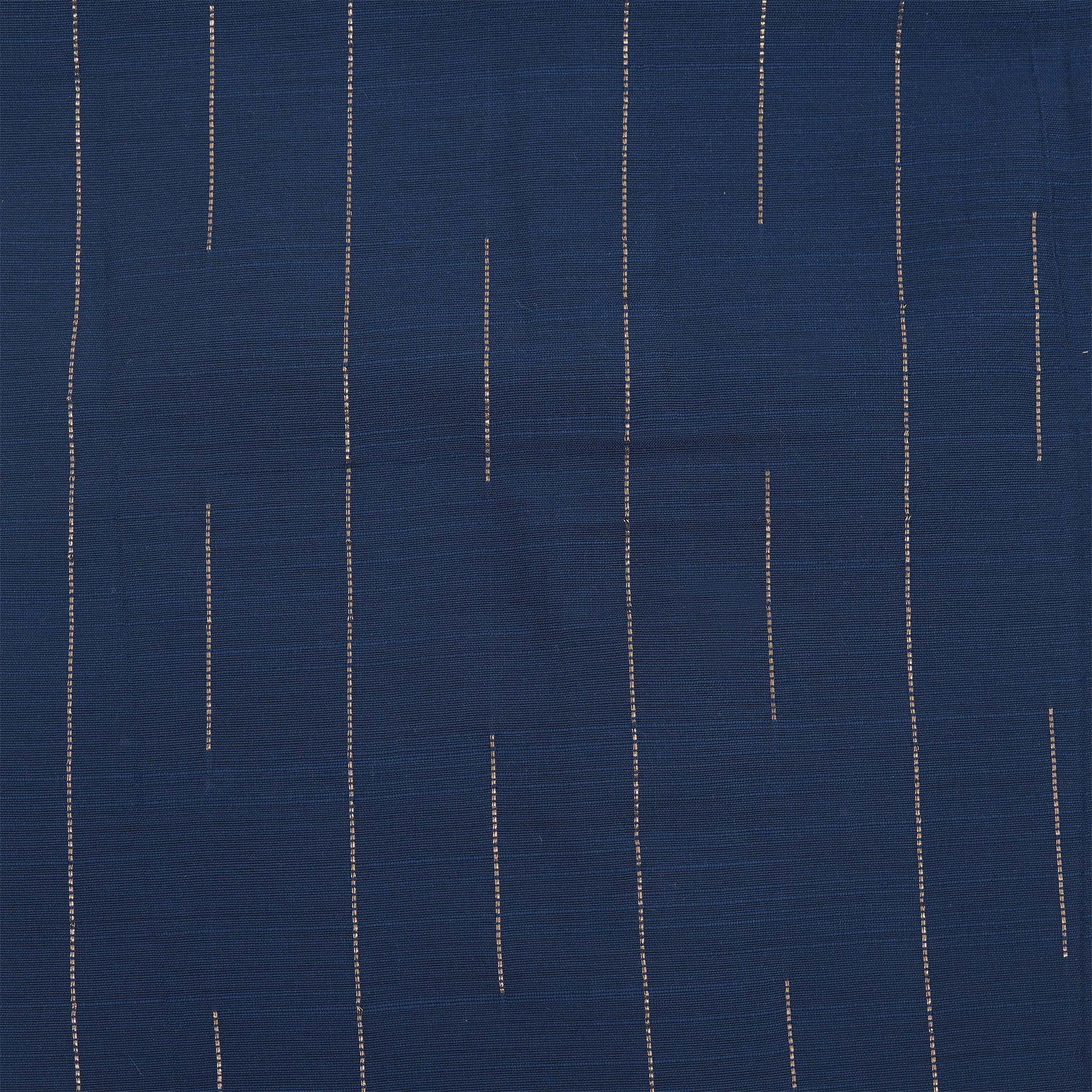 Boys navy blue silk shirt with subtle gold stripes, folded beside a white and gold pattu dhoti – Boon Babies festive wear.
