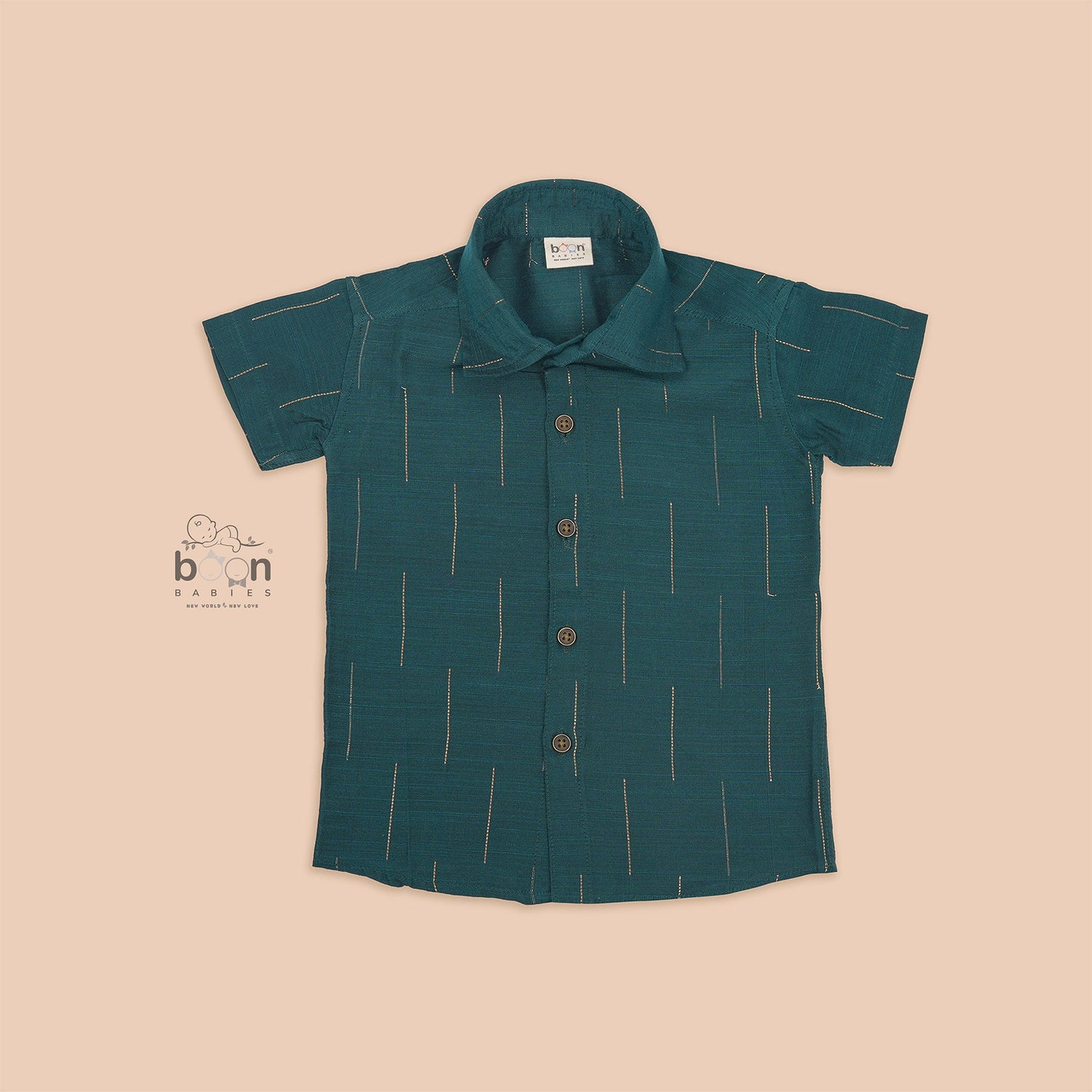 Teal green silk shirt for boys with gold vertical detailing, neatly paired with traditional white pattu dhoti – festive wear set by Boon Babies.
