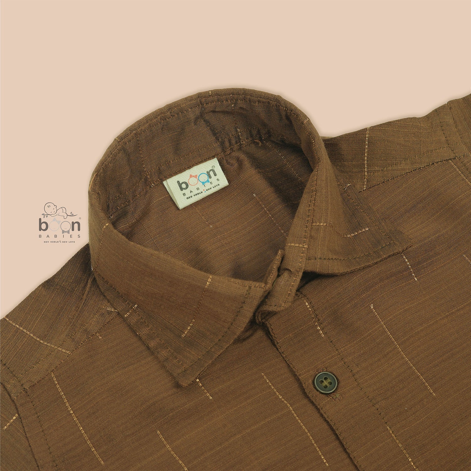 Golden brown silk shirt for boys with gold thread lines, styled with white pattu dhoti – Boon Babies ethnic festive collection.
