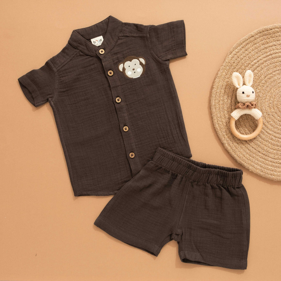 Dark brown boys’ crinkled muslin shirt and shorts set with monkey patch and Chinese collar – breathable summer co-ord by Boon Babies.
