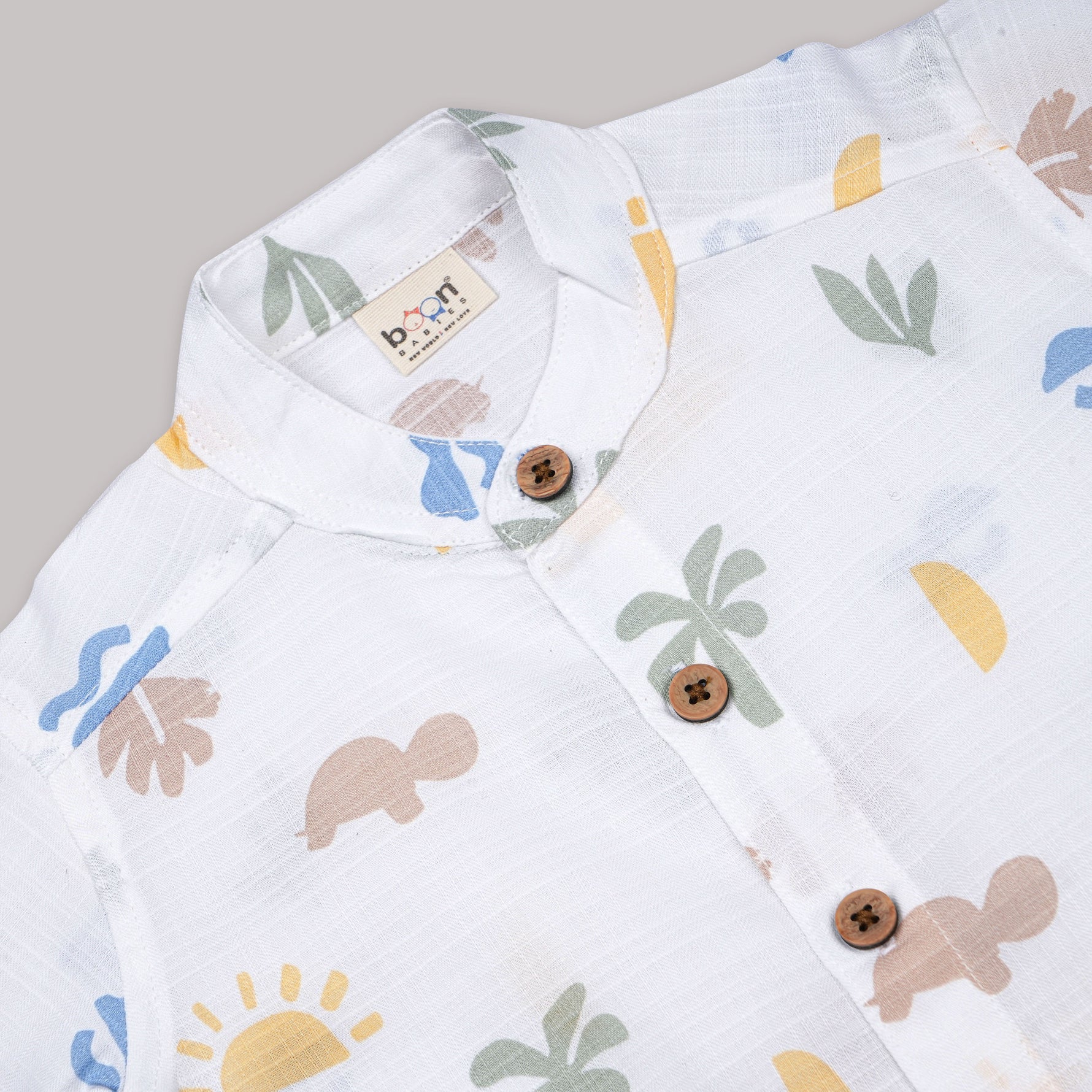 Boys wearing a Boon Babies printed cotton shirt with straight collar and matching shorts, casual summer outfit.