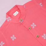 Boys' coral pink handloom cotton shirt and shorts set with printed design and straight collar from Boon Babies.