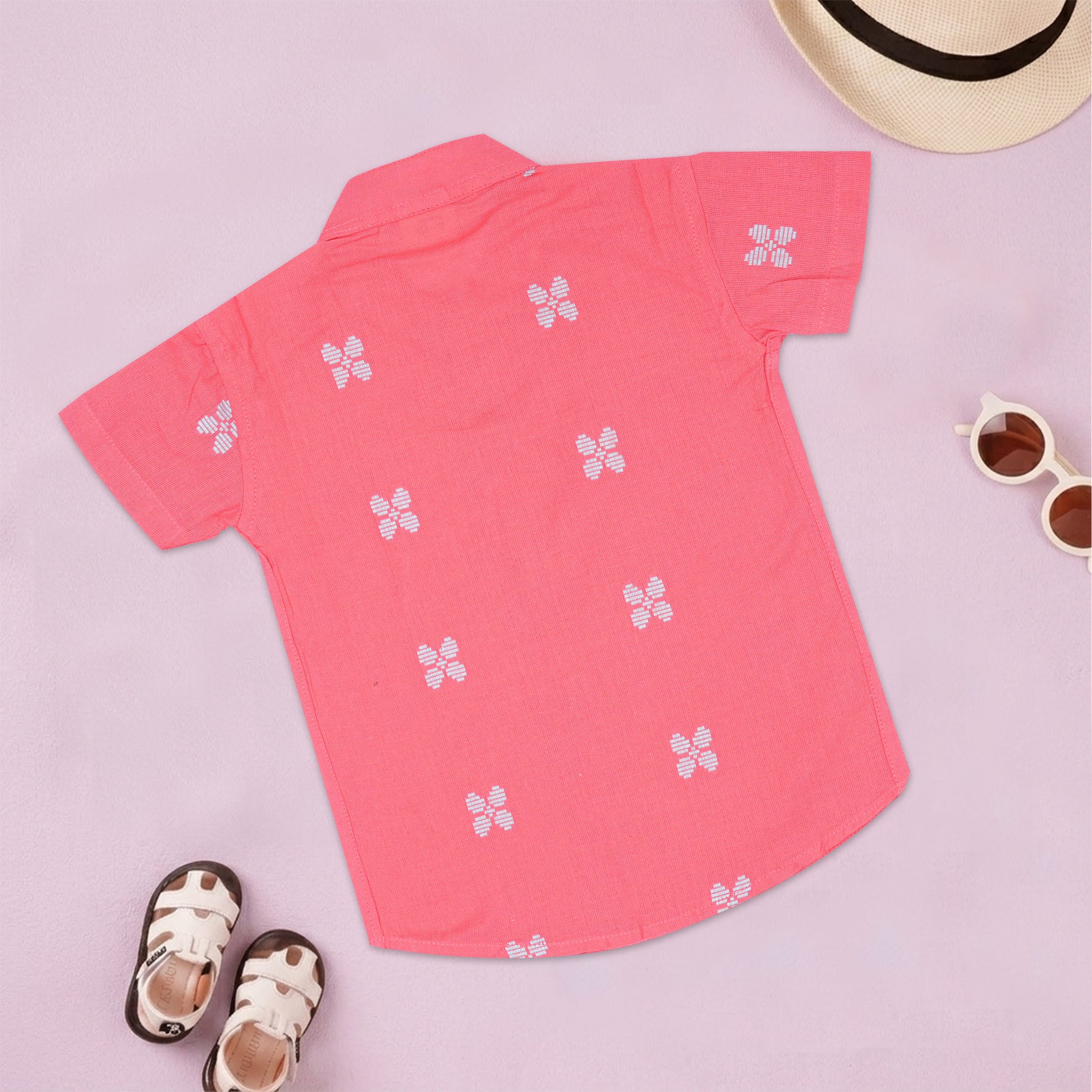 Boys' coral pink handloom cotton shirt and shorts set with printed design and straight collar from Boon Babies.