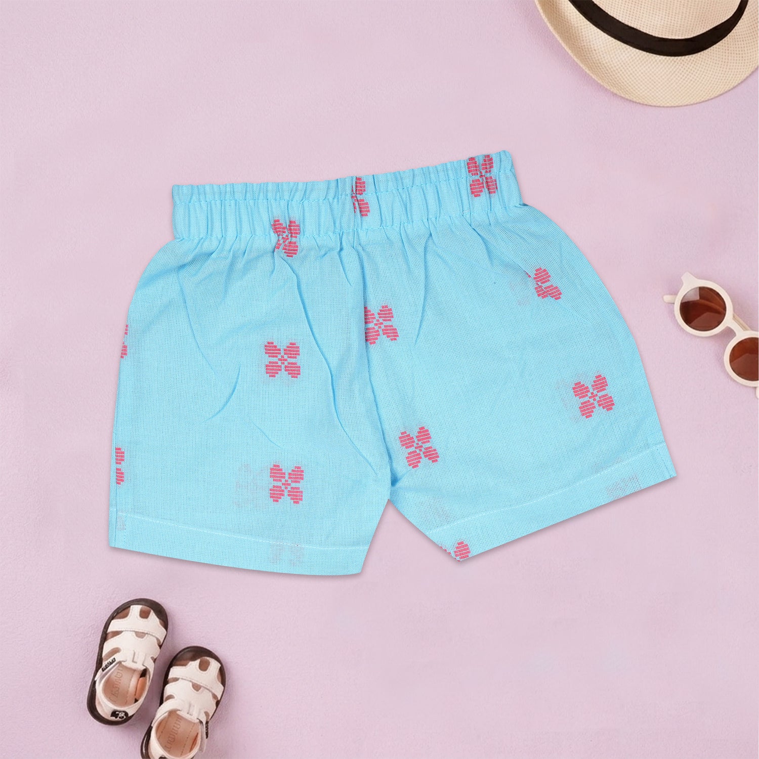 Boys' coral pink handloom cotton shirt and shorts set with printed design and straight collar, by Boon Babies.