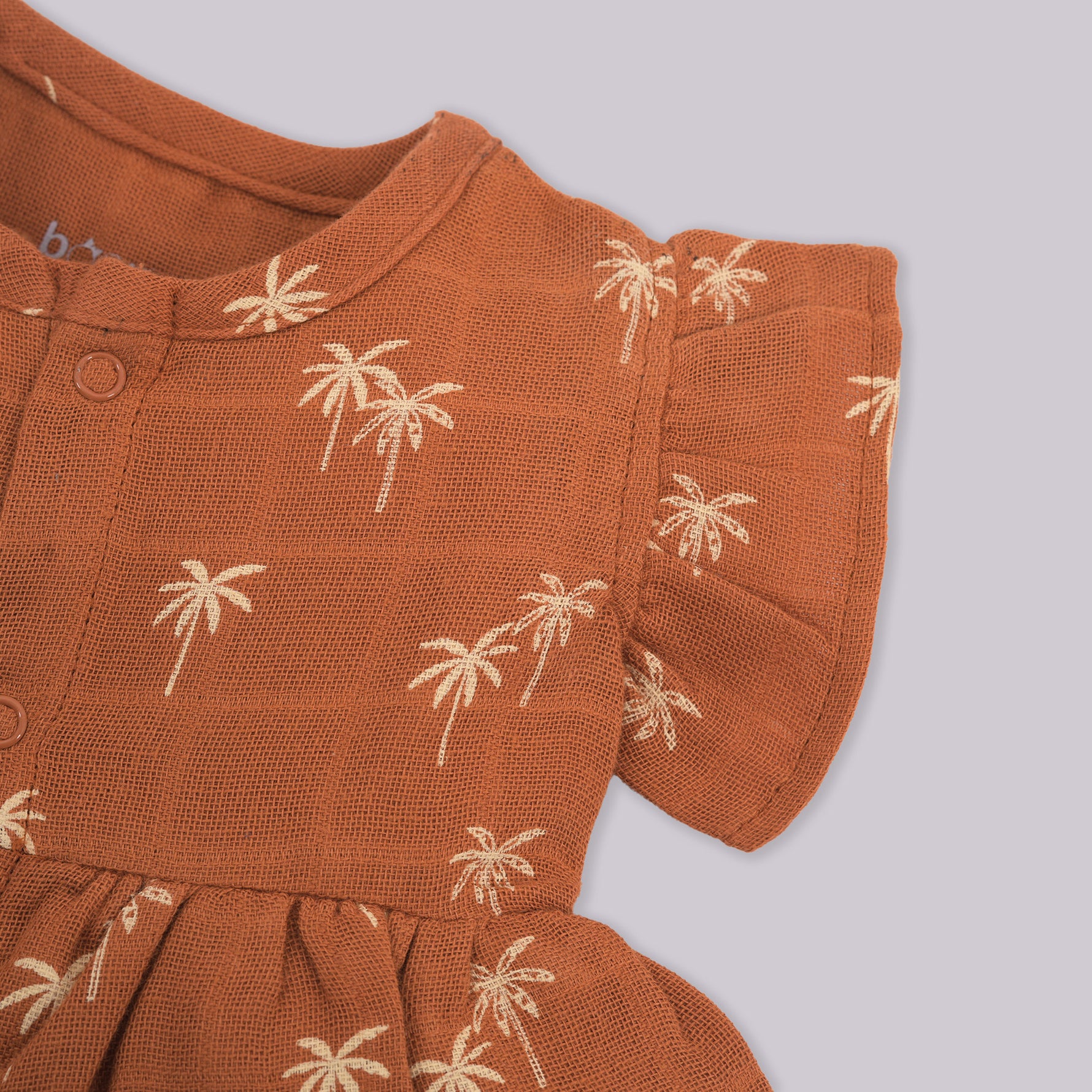 Brown crinkled muslin printed frill frock for baby girls by Boon Babies, featuring delicate frill details.