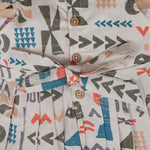 Soft cotton frock for girls featuring multicolor geometric prints and flutter sleeves. Available in sizes 6 months to 5 years. Made in Coimbatore.
