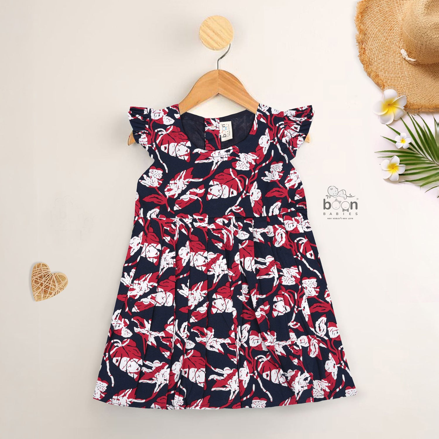 Bold navy cotton frock with red & white florals. Made for 6M–5Y girls. Twirl-ready, comfy, and cute!
