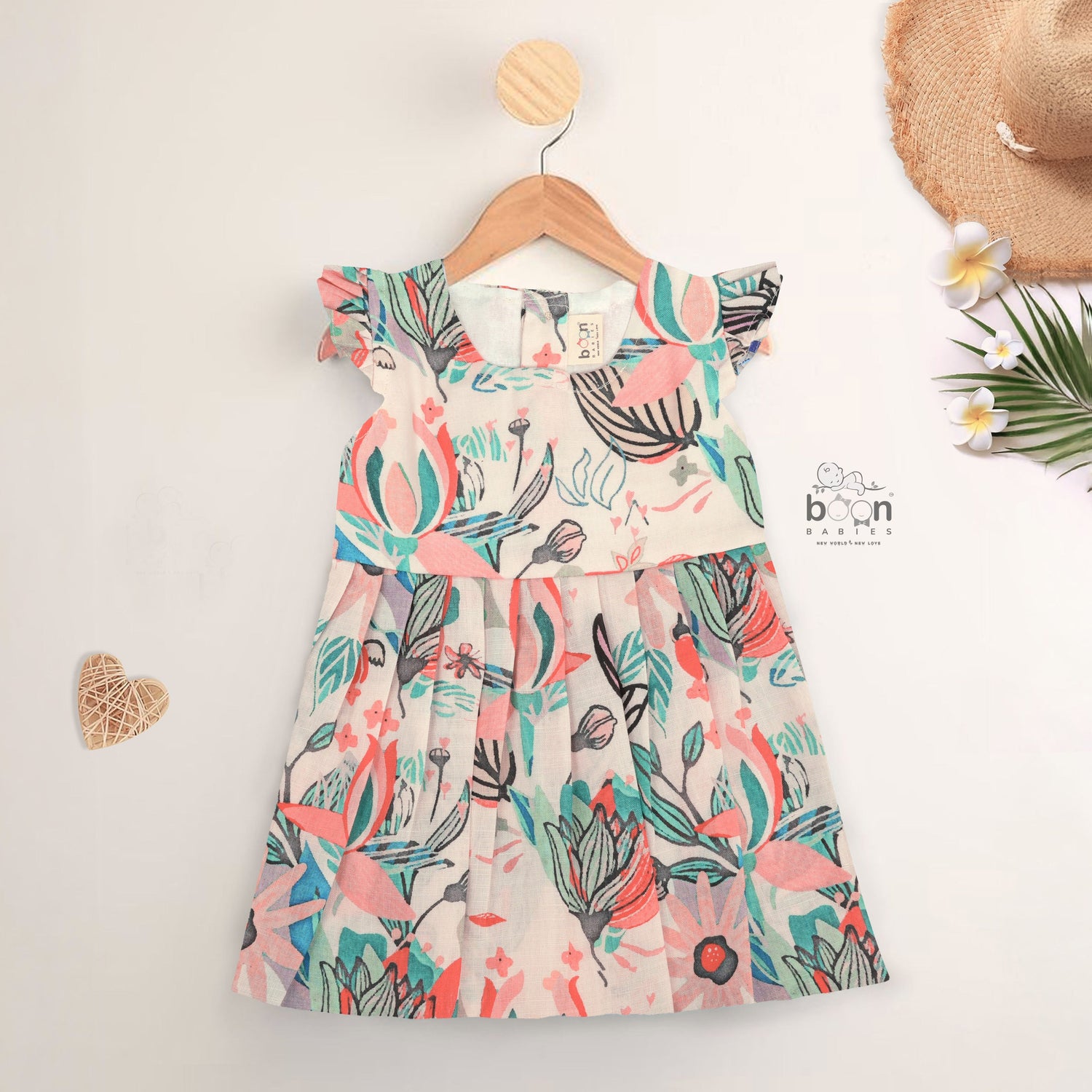 Bright floral cotton frock with cap sleeves for girls aged 6M to 5Y. Made for play, twirls & tropical fun!

