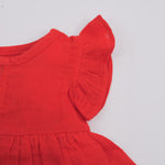 Baby girl crinkled muslin frill frock by Boon Babies featuring a solid design with delicate frill details on the dress.
