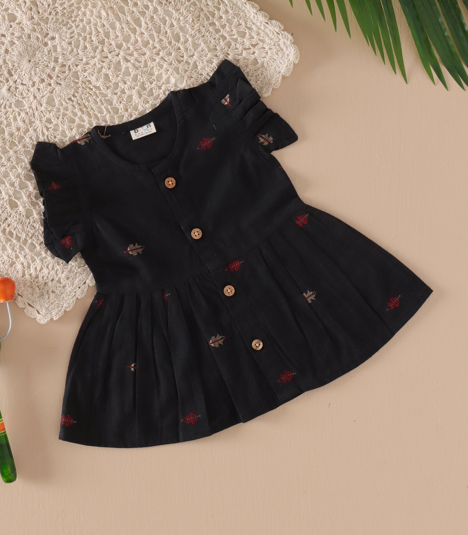 Black South Cotton Baby Frock with Handwoven Butta & Wooden Buttons
