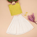 Soft silk sleeveless top and flared skirt set for girls with a classic ethnic look, ideal for festive and outdoor wear.