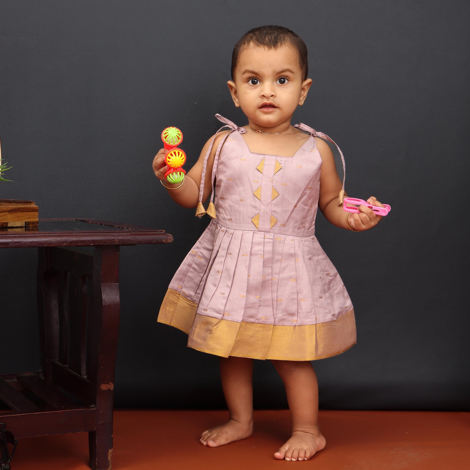 Lavender Chic: Pleated Girls Tieup Frock with Playful Tassels