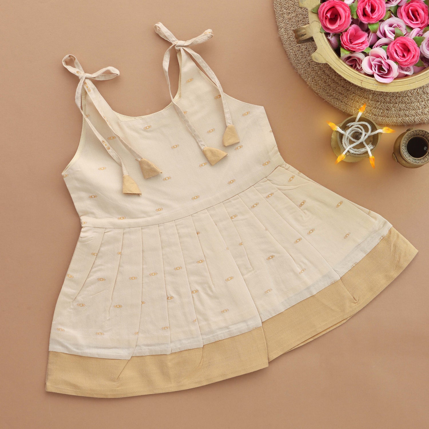 Ivory Whisper: Pleated Skirt Tieup Frock with Charming Tassels