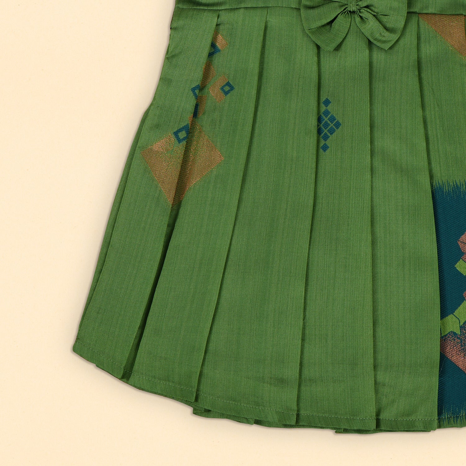 Elegant Green Pleated Frock with Bow and Geometric Accents – Festive Ready