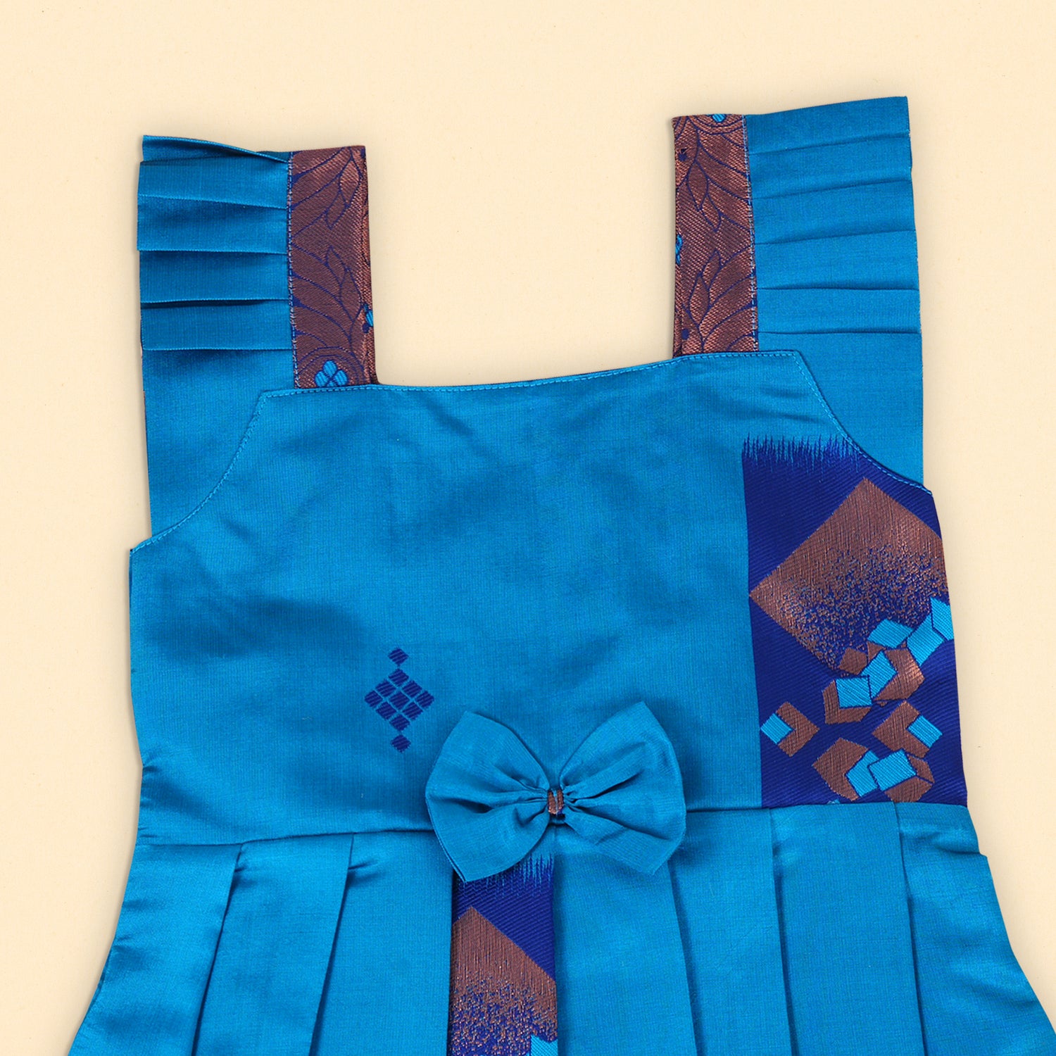 Vibrant Blue Ethnic Frock with Pleated Straps and Elegant Bow