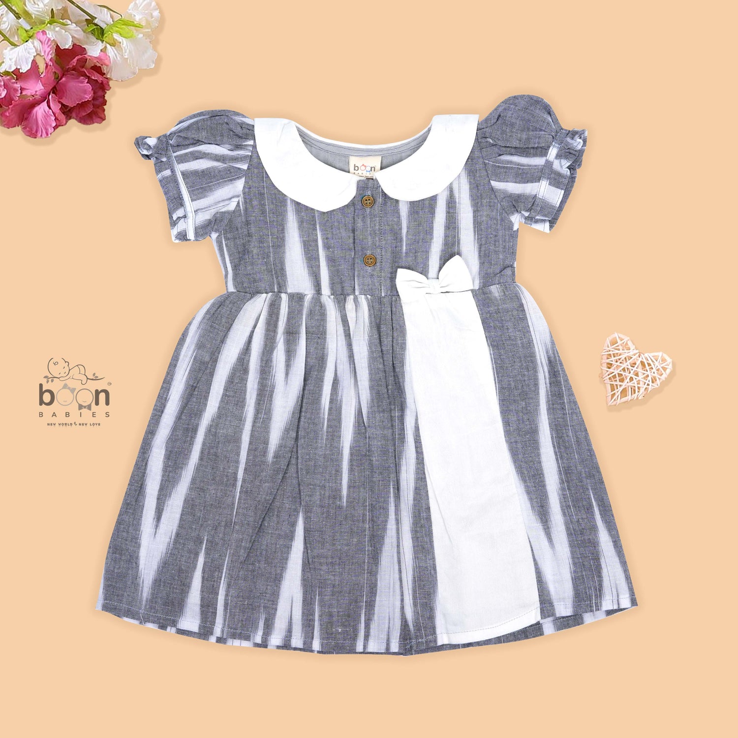 Black & White cotton ikat puff frock with contrast collar & bow. Sizes 6M–4Y. Elegant, comfy & festive-ready.