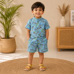 Blue zebra print boys co-ord set with a printed shirt featuring a Chinese collar and matching shorts by Boon Babies.