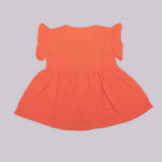 Solid rust orange crinkled muslin frill frock for baby girls.