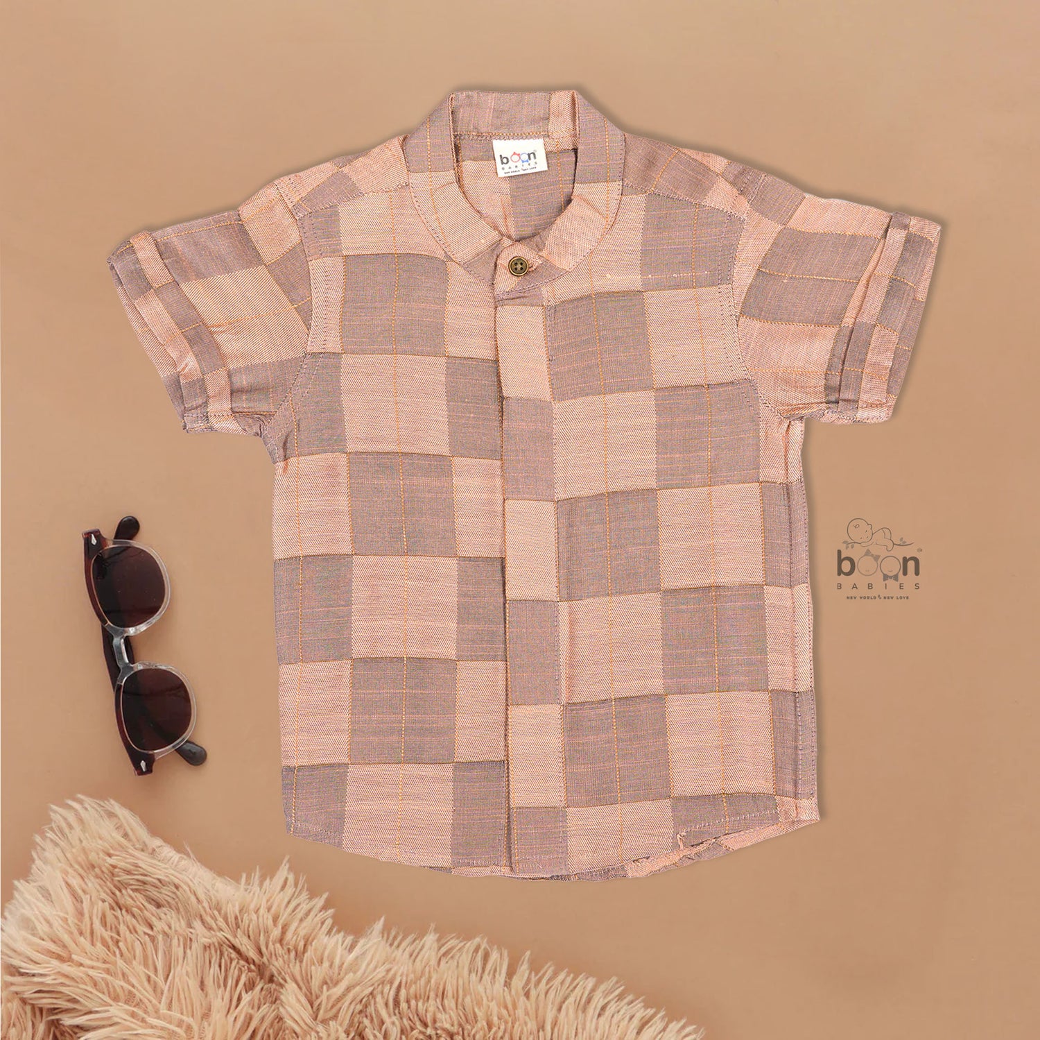 Peach checked silk Chinese collar shirt with white and gold bordered dhoti – boys traditional festive outfit from Boon Babies.
