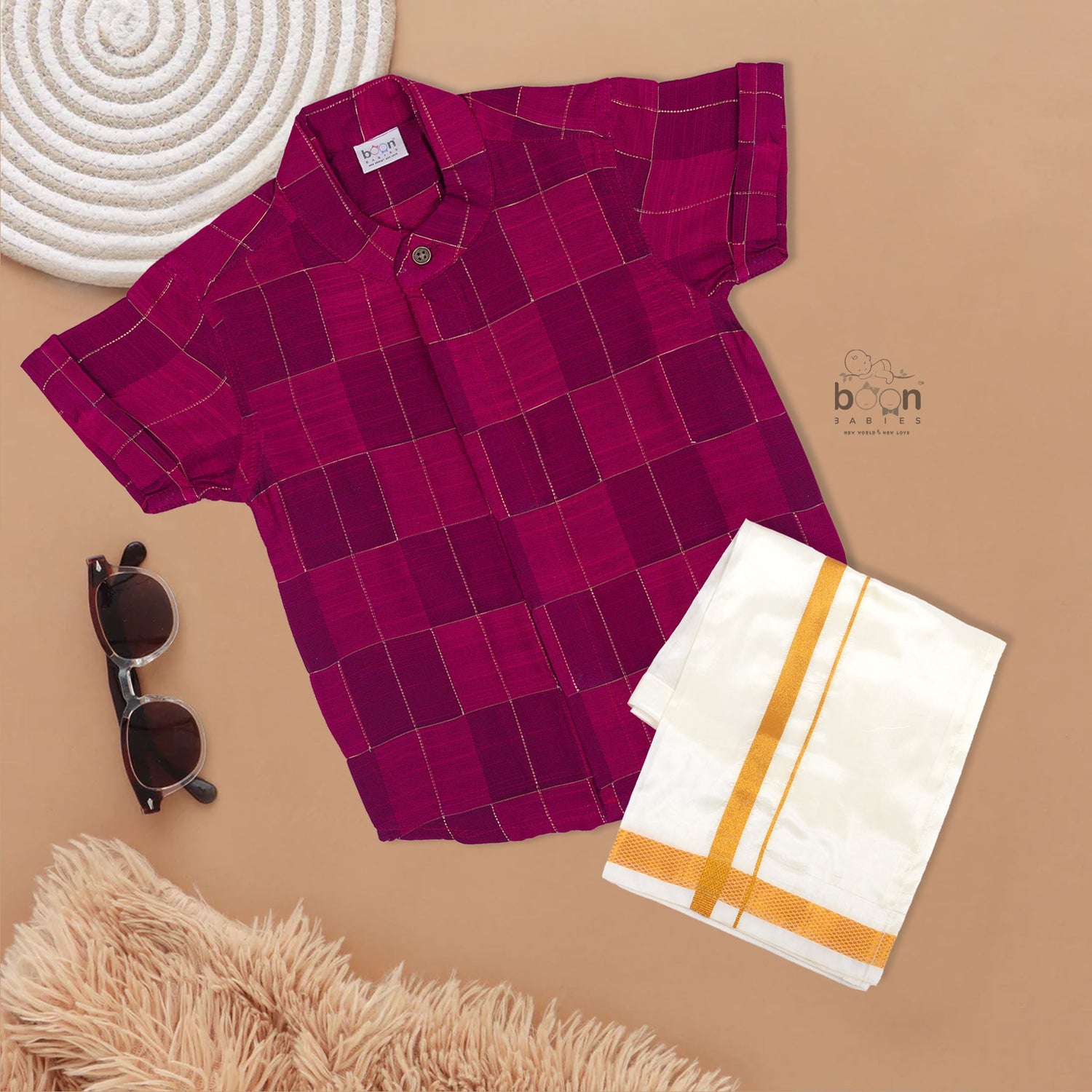 Magenta checked silk shirt with Chinese collar and white dhoti with gold border – boys festive ethnic outfit from Boon Babies.
