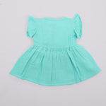 Mint green crinkled muslin frill frock for baby girls by Boon Babies, shown from the back with ruffled details and soft fabric.