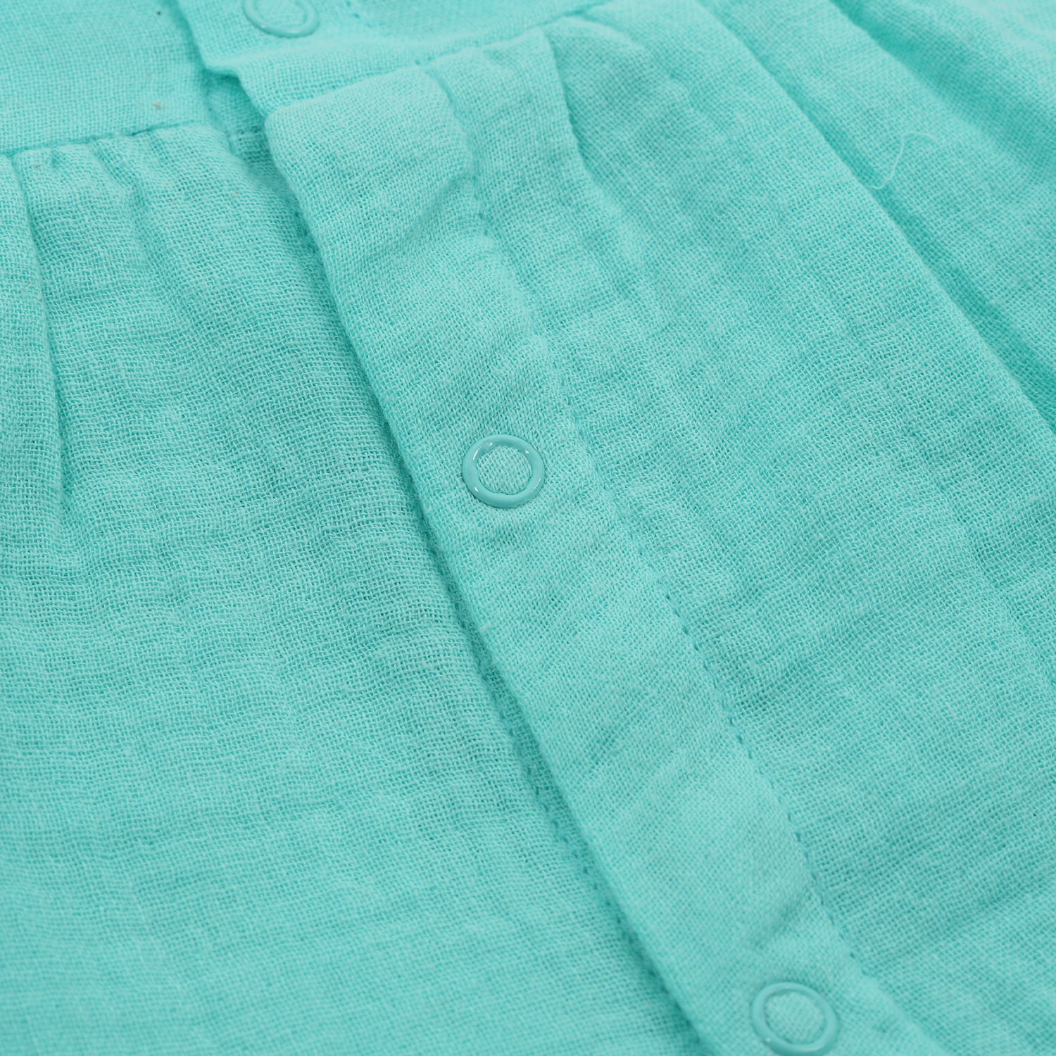 Mint green crinkled muslin frill frock for baby girls by Boon Babies, featuring textured fabric and delicate frill details.