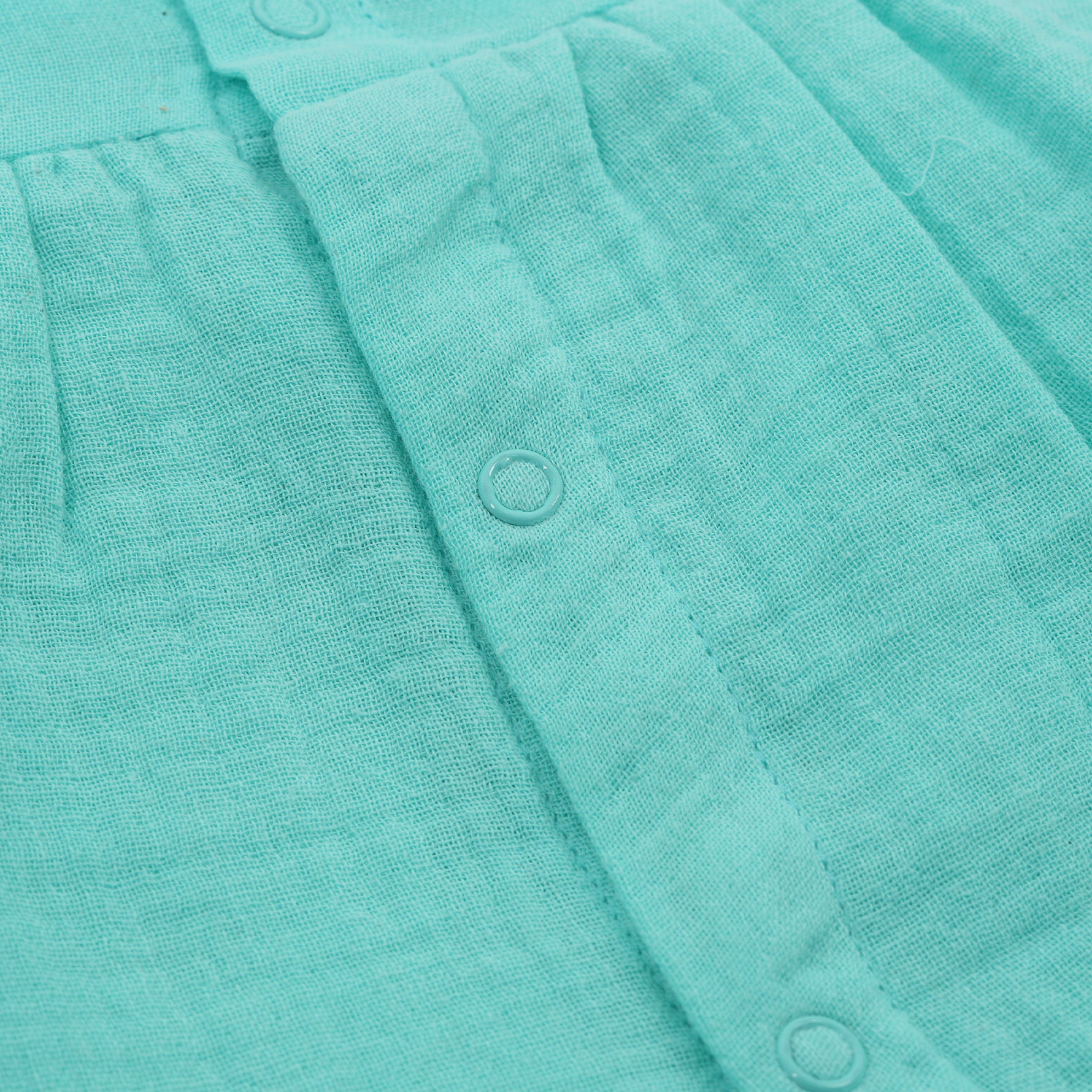 Mint green crinkled muslin frill frock for baby girls by Boon Babies, featuring soft fabric and delicate ruffle details.