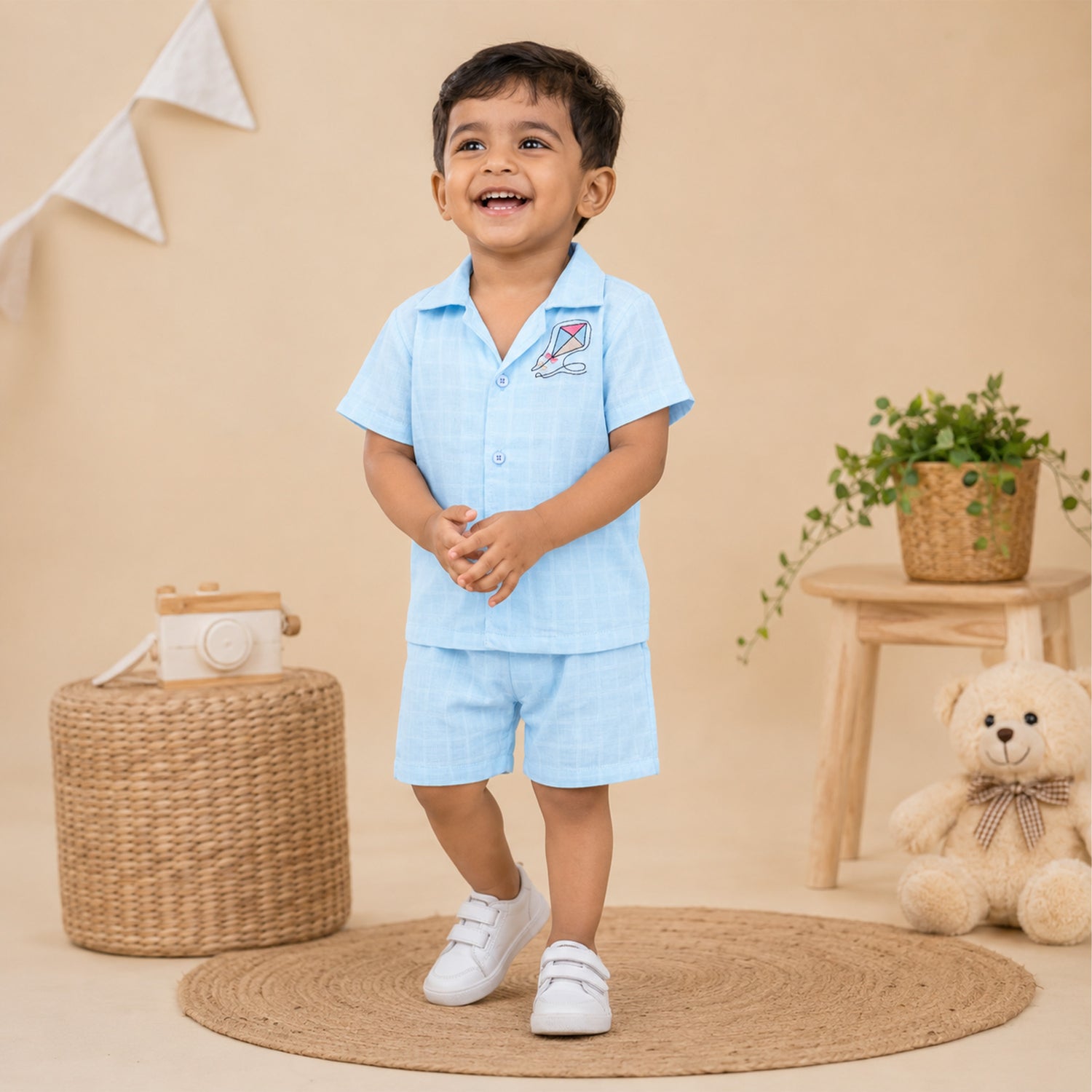 Boys wearing Boon Babies printed muslin casual shirt with open collar and matching shorts, perfect for summer wear.
