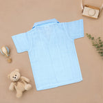 Boy wearing Boon Babies printed muslin casual shirt with straight collar and matching shorts, perfect for summer wear.