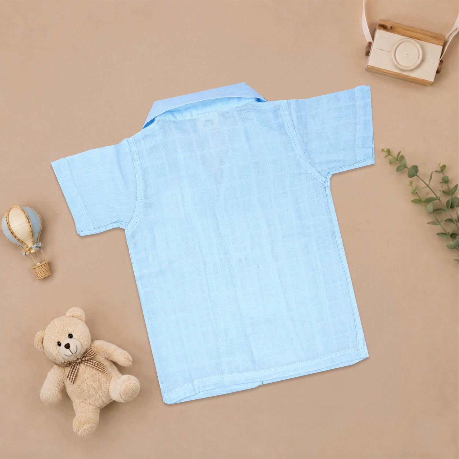 Boy wearing Boon Babies printed muslin casual shirt with straight collar and matching shorts, perfect for summer wear.