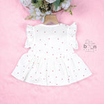 Sweet and soft muslin baby frock with red heart prints. Ages 3–18 months. Designed for comfort, perfect for everyday cuteness.