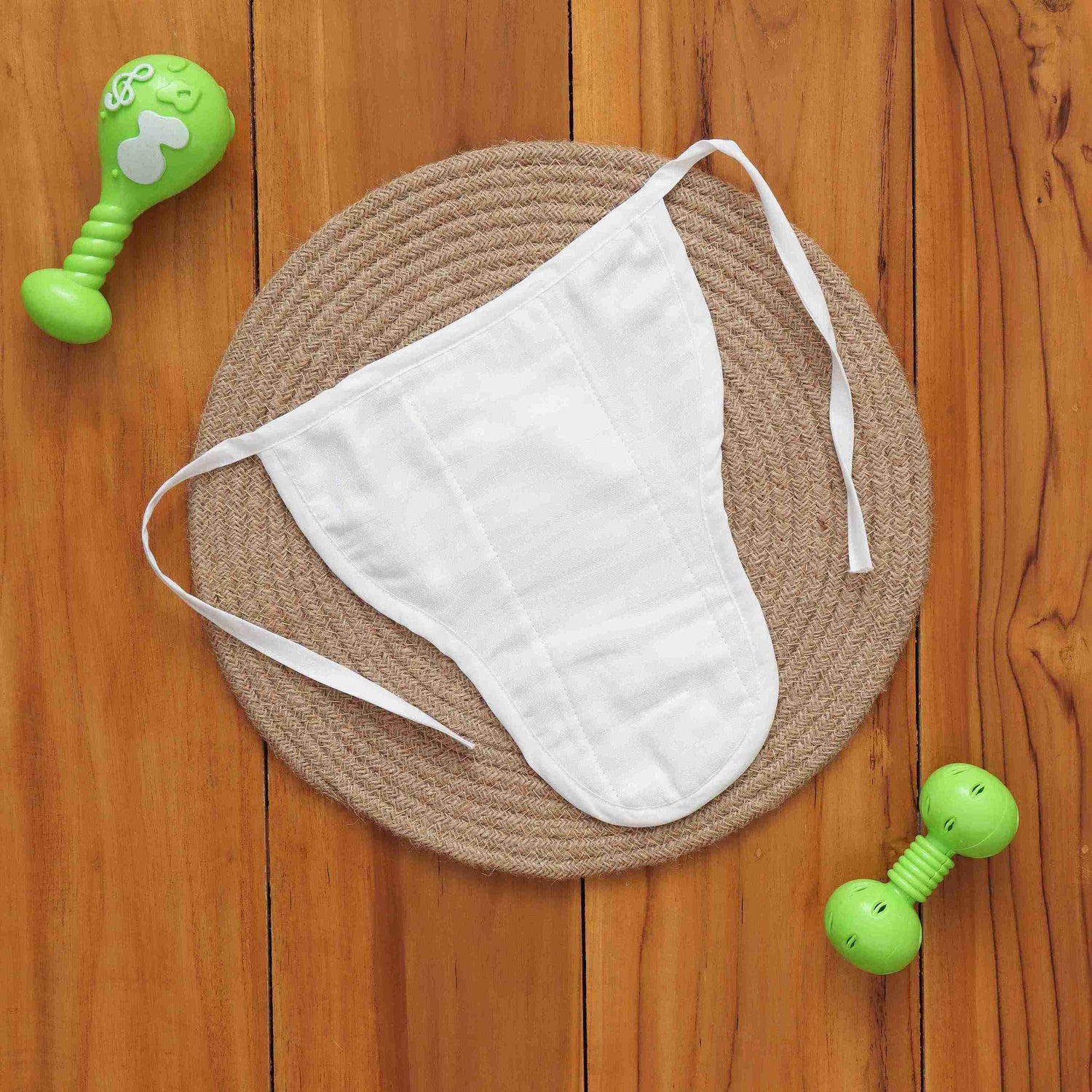 White muslin baby nappy with bunny print. For 0–3 months. Soft, reusable, and skin-friendly with easy tie closure.