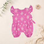 Baby girl baby romper in pink with muslin fabric, printed design and frill sleeves, by Booon Babies.