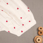 Baby girl baby romper with printed muslin fabric and frill sleeves from Boon Babies, featuring a cute, comfortable design.