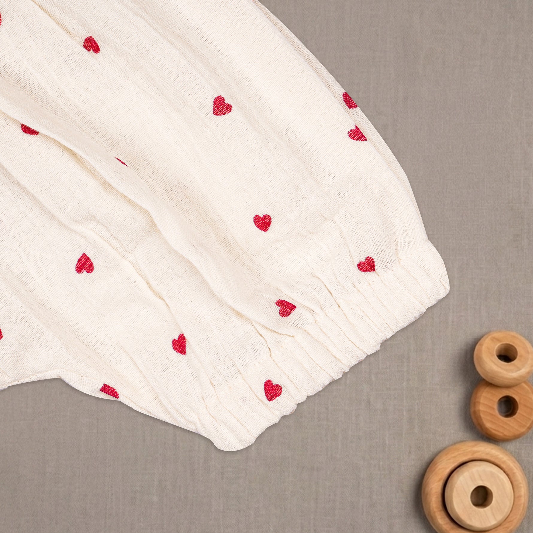 Baby girl baby romper with printed muslin fabric and frill sleeves from Boon Babies, featuring a cute, comfortable design.