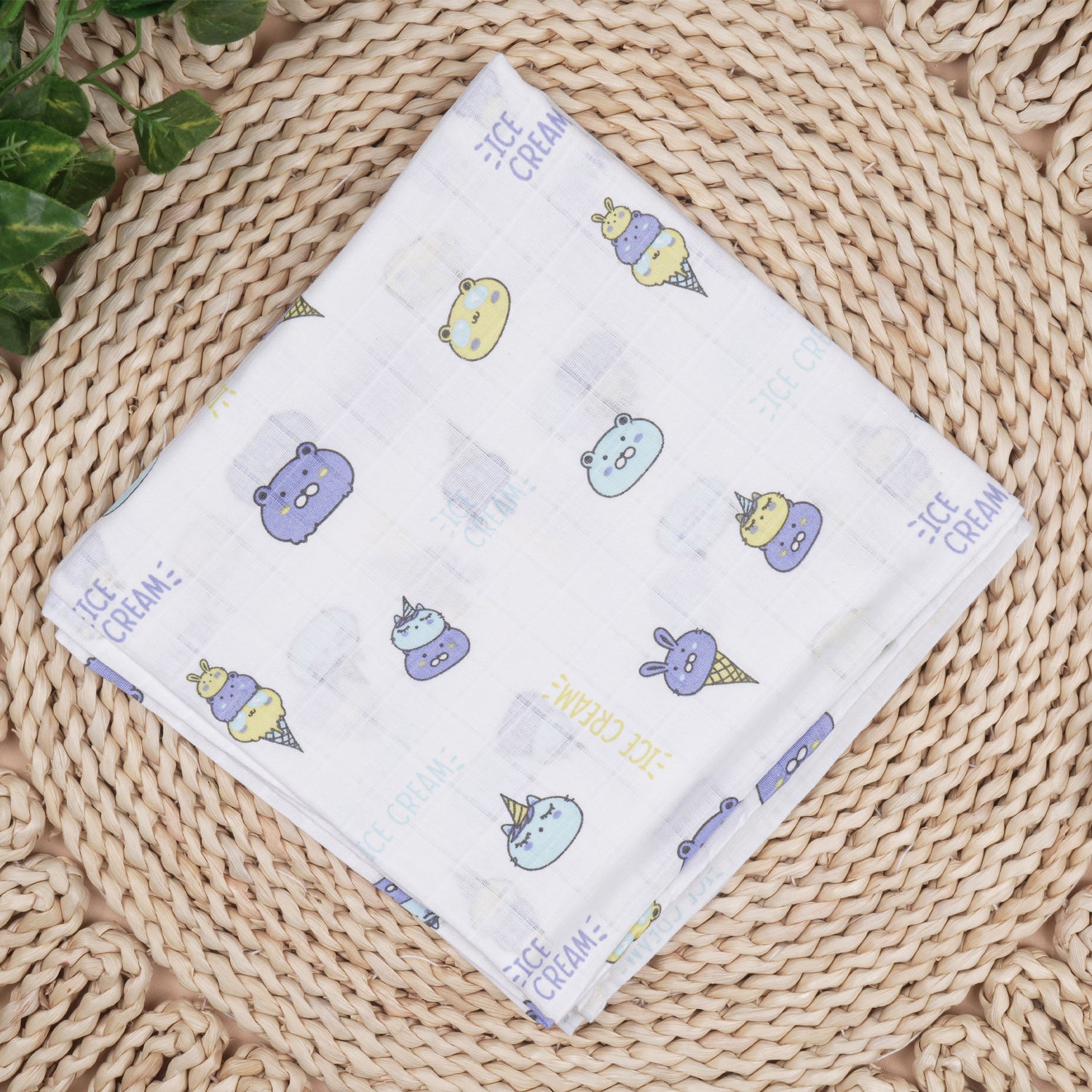 Soft, breathable Boon Babies muslin swaddle blanket with printed design, 100x100 cm, perfect for wrapping and soothing a baby.