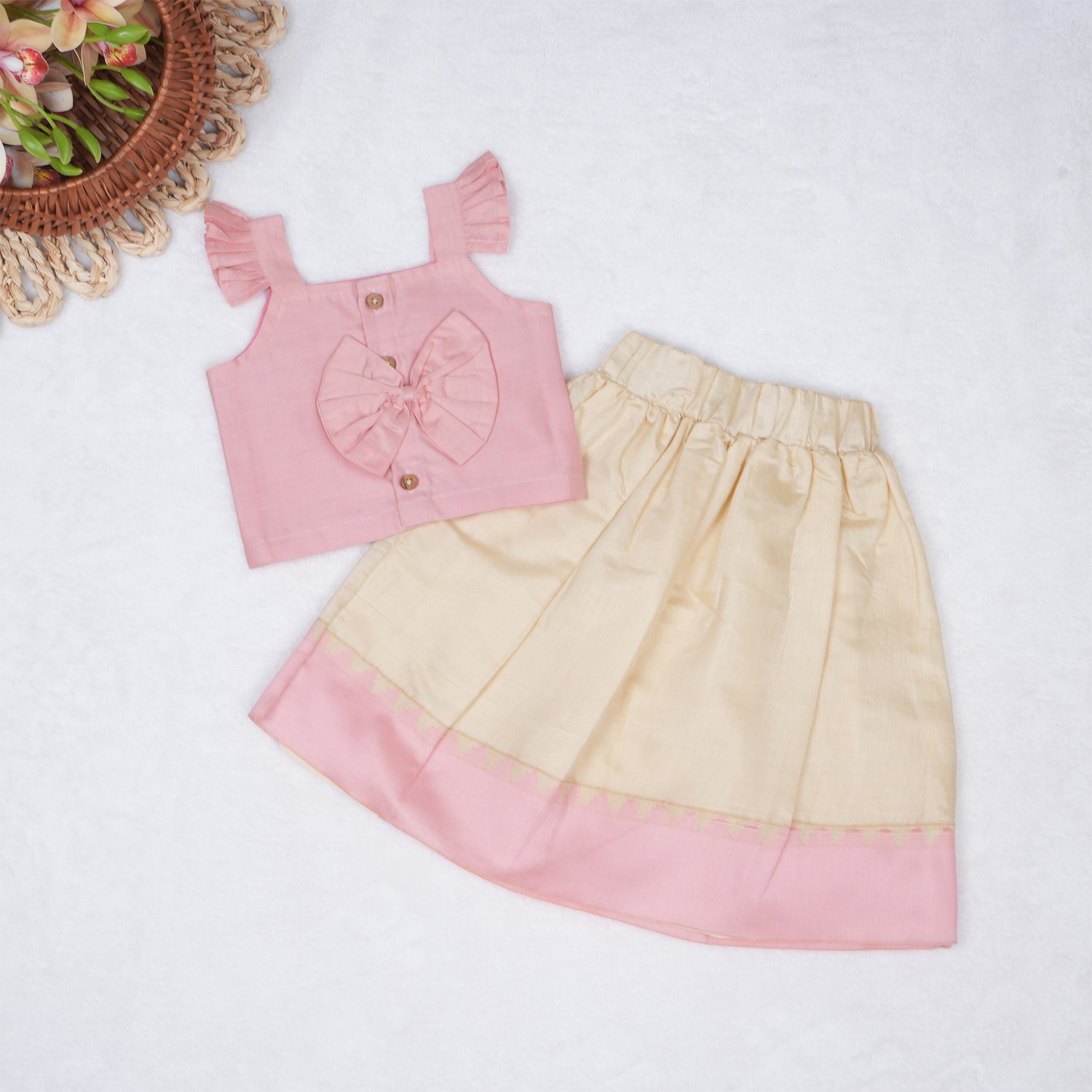 Blush pink embroidered cotton top with cream skirt, elastic waist and lining – elegant Kerala-style ethnic wear for girls aged 1–5 years.