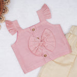 Blush pink embroidered cotton top with cream skirt, elastic waist and lining – elegant Kerala-style ethnic wear for girls aged 1–5 years.