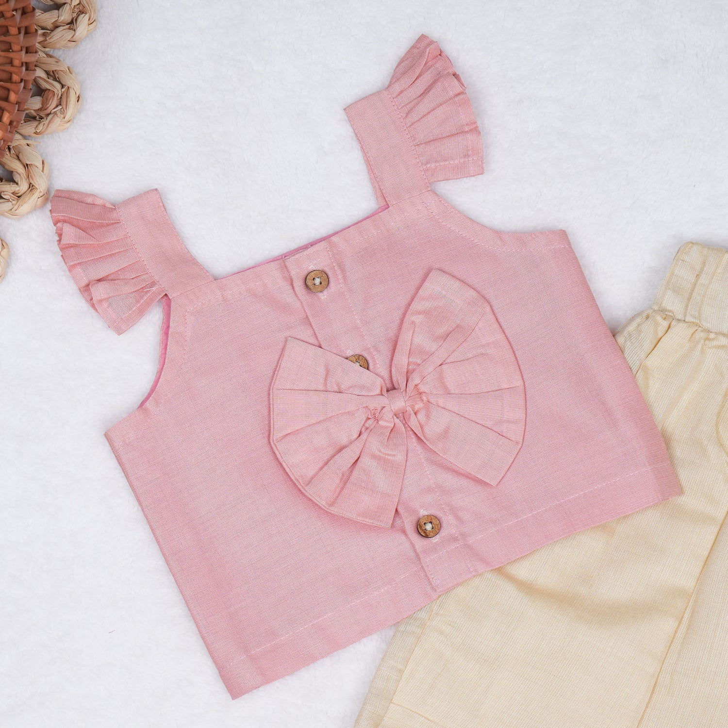 Blush pink embroidered cotton top with cream skirt, elastic waist and lining – elegant Kerala-style ethnic wear for girls aged 1–5 years.