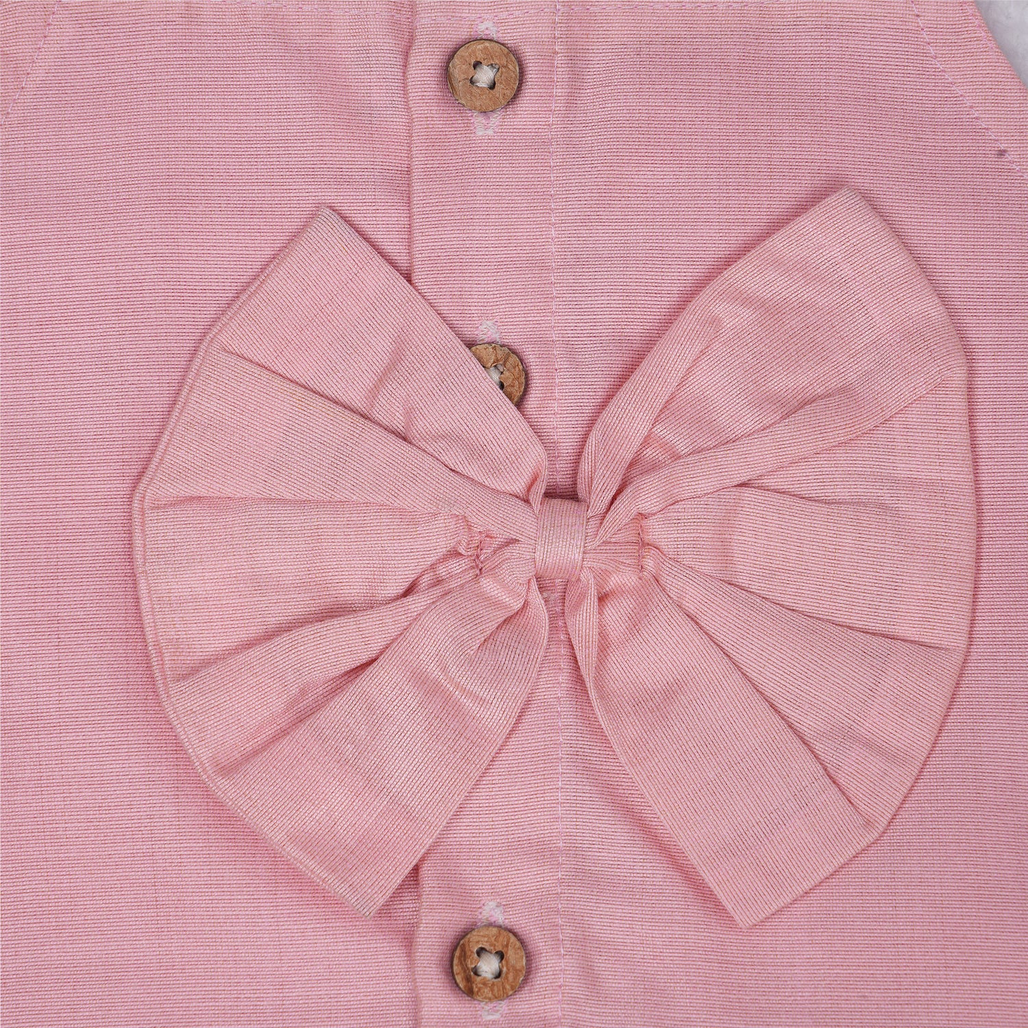 Blush pink embroidered cotton top with cream skirt, elastic waist and lining – elegant Kerala-style ethnic wear for girls aged 1–5 years.