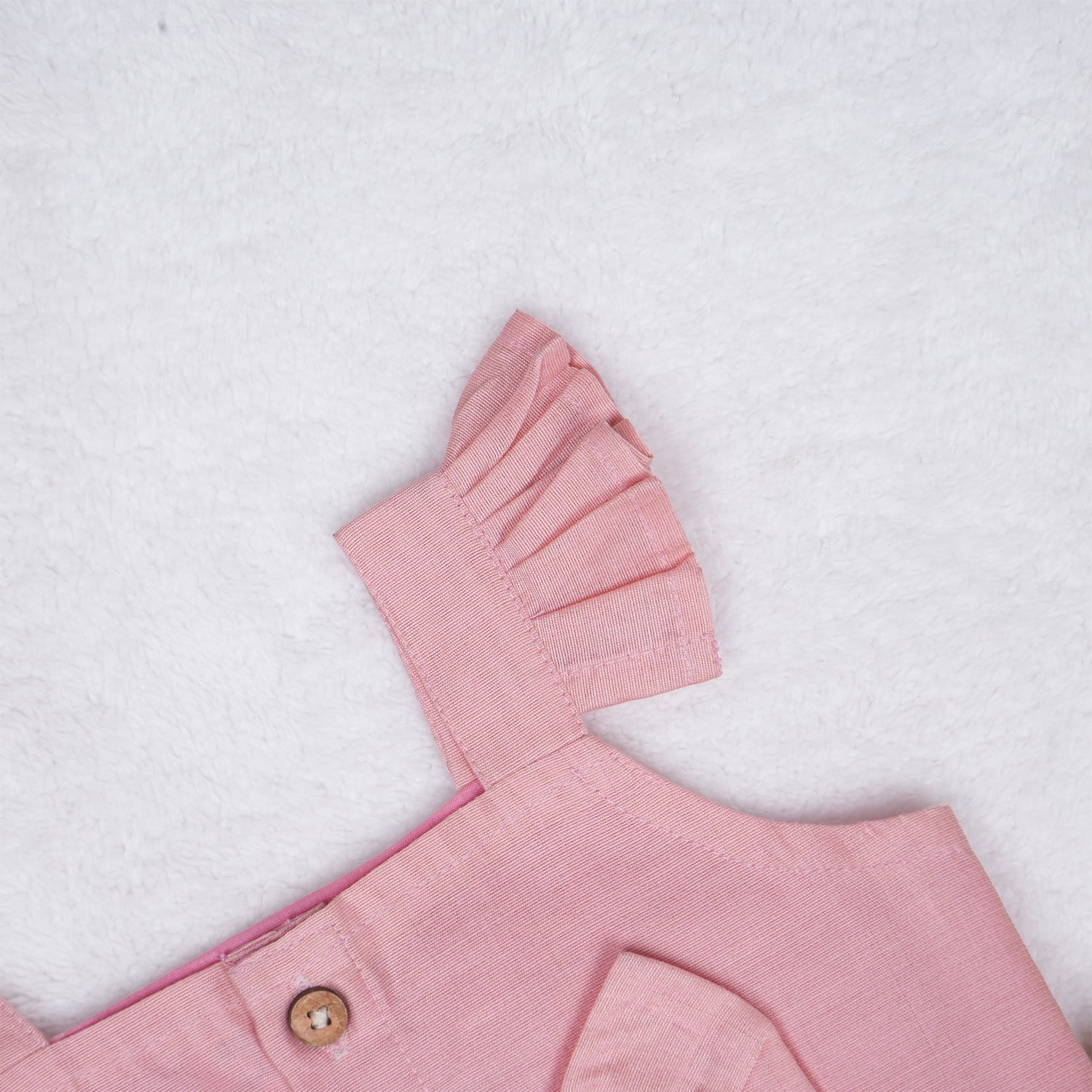 Blush pink embroidered cotton top with cream skirt, elastic waist and lining – elegant Kerala-style ethnic wear for girls aged 1–5 years.