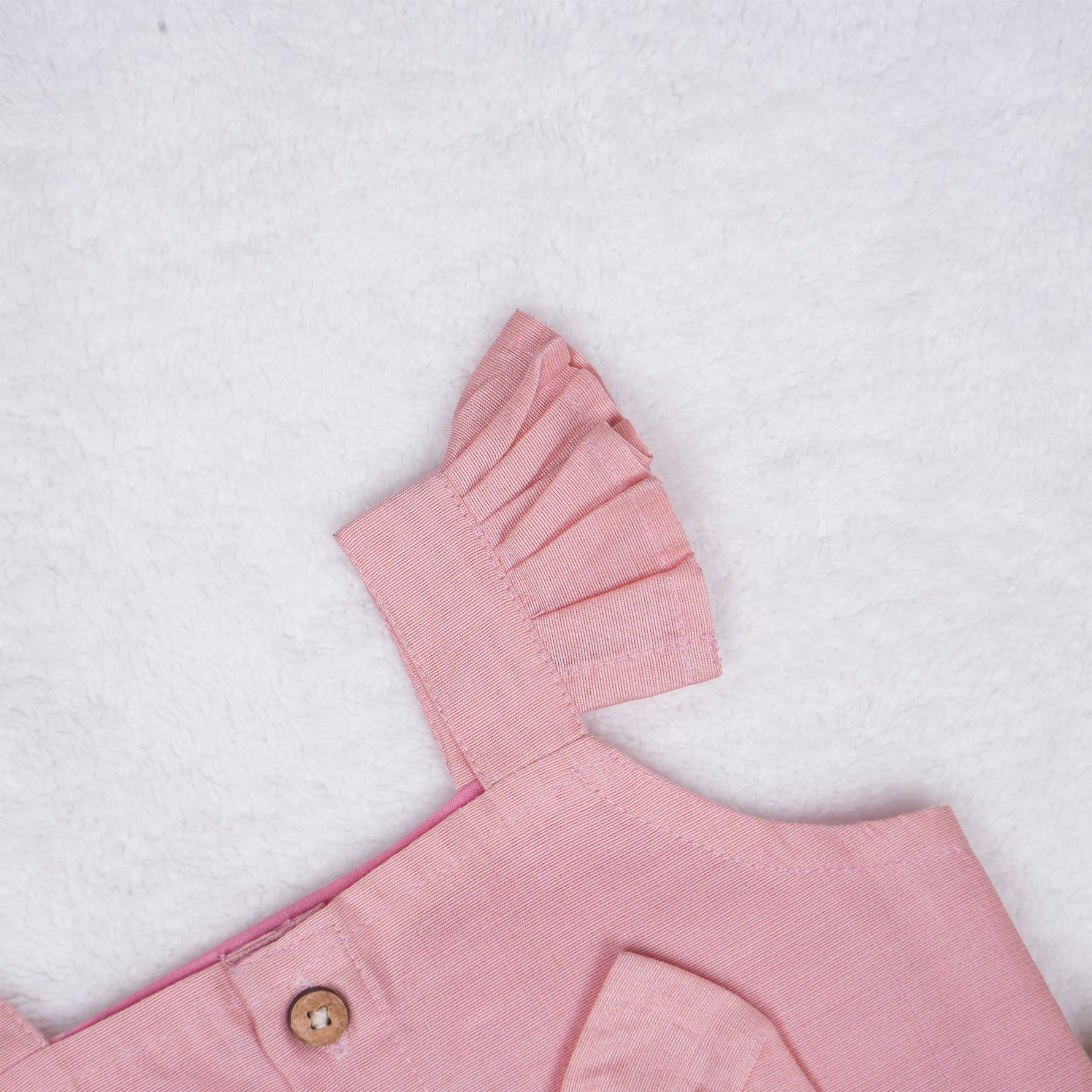 Blush pink embroidered cotton top with cream skirt, elastic waist and lining – elegant Kerala-style ethnic wear for girls aged 1–5 years.