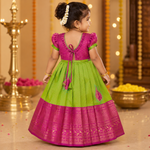 Girls' green and pink tissue silk Pattu Pavadai ethnic frock by Boon Babies with intricate embroidery and traditional design.